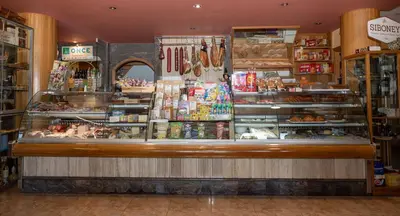 a bakery with a counter in a store at Hostal O'Cruceiro in O Pino