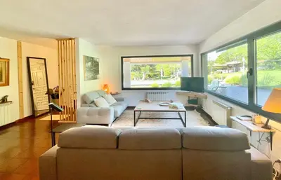 a living room with a couch and a table at VILLA GUIMIL - GALICIA PLAYA in Villarmayor
