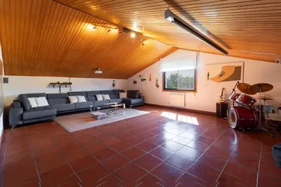 a living room with a couch and a table at VILLA GUIMIL - GALICIA PLAYA in Villarmayor