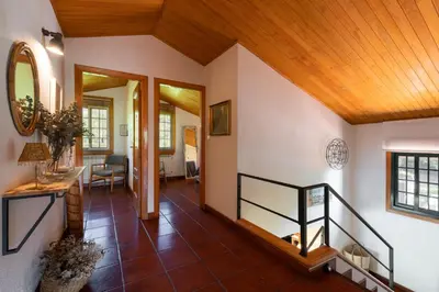 a hallway with a staircase in a house at VILLA GUIMIL - GALICIA PLAYA in Villarmayor