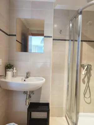 a bathroom with a sink and a shower at Apartagal-San Miguel Barreiros in Barreiros