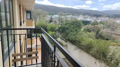 a balcony of a building with a view of a city at Apartagal-San Miguel Barreiros in Barreiros