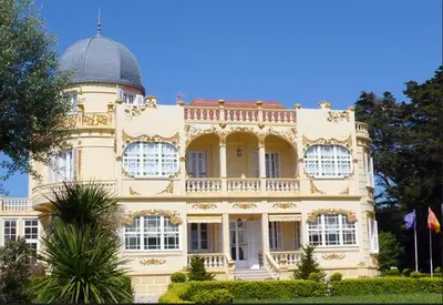 a large building with a dome on top of it at Hotel Palacete Peñalba in Castropol