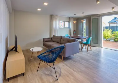 a living room with a couch and a table at APARTAMENTOS BARCELLA TAPIA in Tapia de Casariego