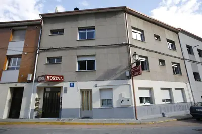 a building on the corner of a street at Hostal Cruce in Villafranca del Bierzo