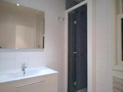 a bathroom with a sink and a shower at YEDRA in Ourense
