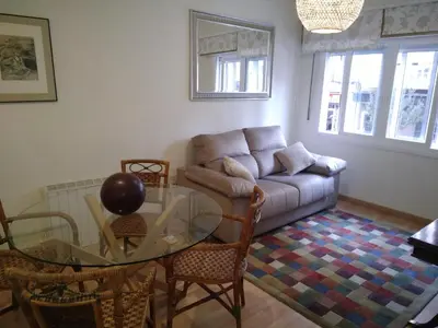 a living room with a couch and a glass table at YEDRA in Ourense