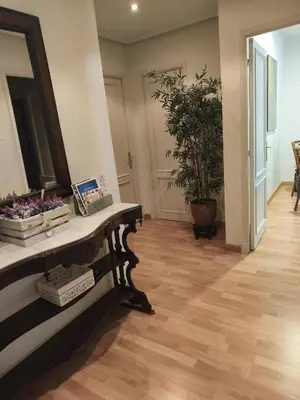 a room with a mirror and a table with plants at YEDRA in Ourense