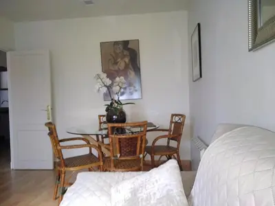 a living room with a table and chairs and a bed at YEDRA in Ourense