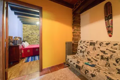 a bedroom with a bed and a window in a room at Casa Bouza in Becerreá