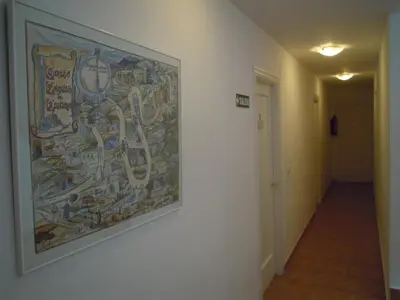 a large painting on a wall in a hallway at Albergue O Durmiñento in Sarria