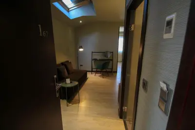a living room with a couch and a skylight at Hotel Torre de Núñez in Lugo
