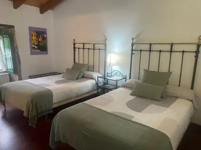 a bedroom with two beds at Casa Blanco in Palas de Rei