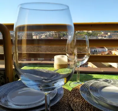 two wine glasses sitting on a table with a view at Casa FR VUT-OR-0345 in Ourense