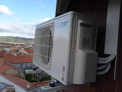 an air conditioner on the side of a building at Casa FR VUT-OR-0345 in Ourense