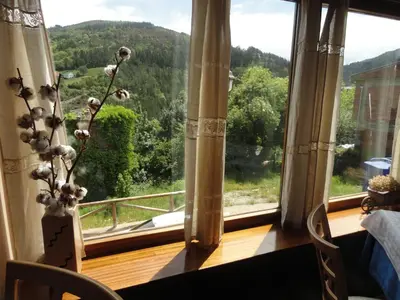 a room with a window with a view of a mountain at Hotel Restaurante Casa Petronila in Taramundi