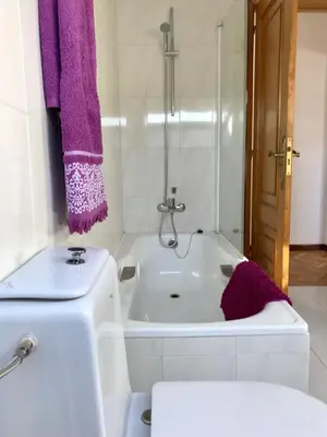 a white bathroom with a tub and a sink at VUT-OR-182 Atico Emilia Pardo Bazán in Allariz