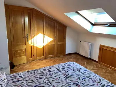 a bedroom with a bed and a skylight at VUT-OR-182 Atico Emilia Pardo Bazán in Allariz