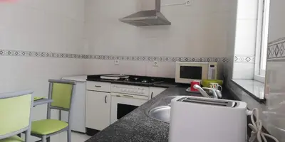 a kitchen with a sink and a stove at Elena in Arzúa