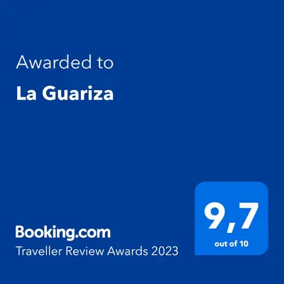 a blue screen with the text awarded to la guarica at La Guariza in Villablino