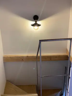 a staircase in a room with a ceiling at La casa de Lucas y Alex in Ponferrada