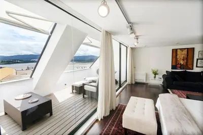 a living room with white walls and large windows at Exclusiva vivienda de lujo in Foz