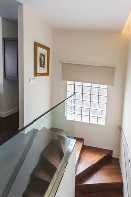 a glass staircase in a house with a window at Exclusiva vivienda de lujo in Foz