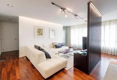 a living room with a couch and a table at Exclusiva vivienda de lujo in Foz