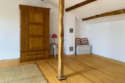a room with a wooden door and a wooden floor at Casa Rural As Bodegas - Villa Rustica Asturias - Boal in Boal