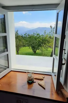 a window with a view of a green field at Casa Rural As Bodegas - Villa Rustica Asturias - Boal in Boal