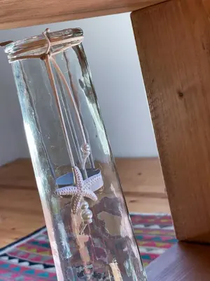 a clear glass vase with a starfish in it at Casa Rural As Bodegas - Villa Rustica Asturias - Boal in Boal