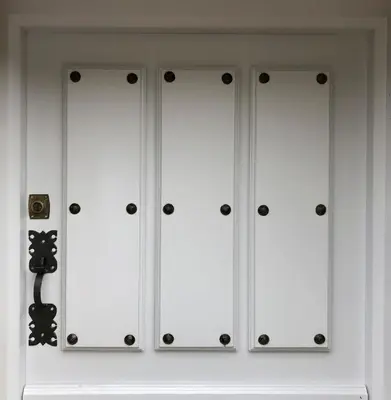 a white closet with black knobs on it at Casa Rural As Bodegas - Villa Rustica Asturias - Boal in Boal