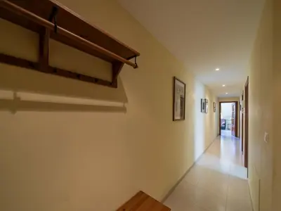 a hallway of a house with a staircase and a hallway at Apartment Edificio Bahia II by Interhome in Miño