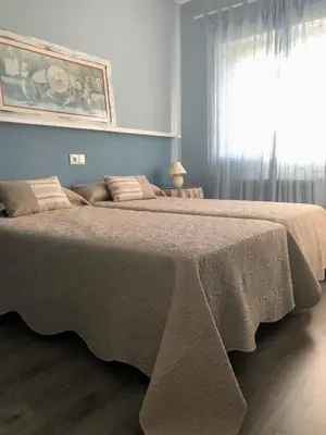 a large bed in a bedroom with a window at La Barranca in Barreiros