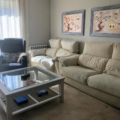 a living room with two couches and a coffee table at La Barranca in Barreiros