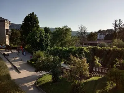 a view of a park with benches and trees at Vivenda turística CENTRO HISTÓRICO in Allariz