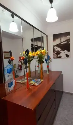a wooden counter with vases of flowers on it at Buen camino in Santiago de Compostela