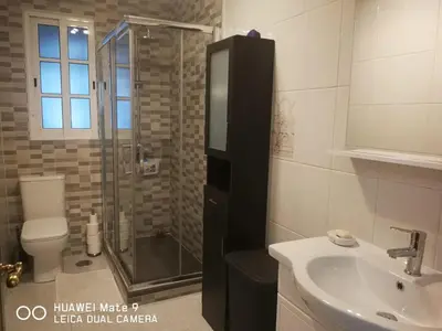 a bathroom with a shower and a toilet and a sink at Buen camino in Santiago de Compostela