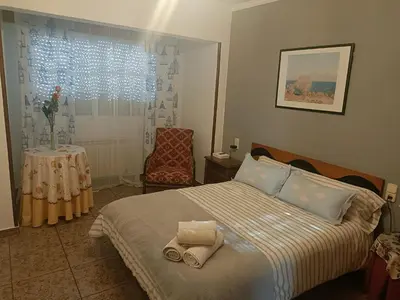 a bedroom with a bed with two towels on it at Buen camino in Santiago de Compostela