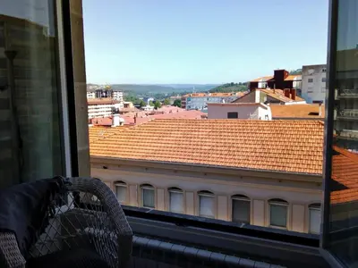 a view of a building from a window at Morriña in Ourense
