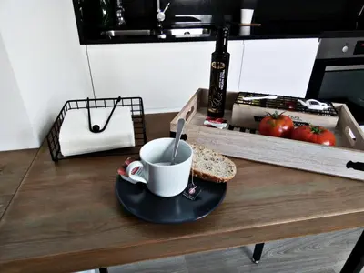 a cup of coffee and a slice of bread on a table at Morriña in Ourense