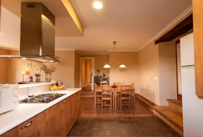 a kitchen with a table and a dining room at Vieiro Verde in Vieiro