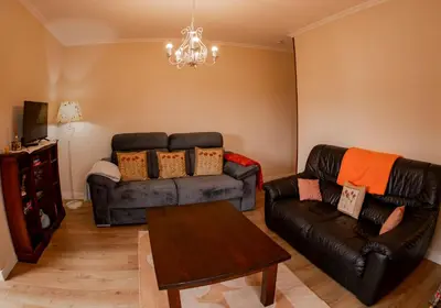 a living room with two couches and a table at Vieiro Verde in Vieiro