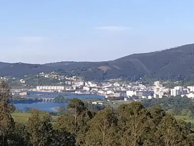 a view of a city with a lake and buildings at Vieiro Verde in Vieiro