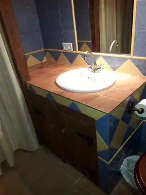 a bathroom with a sink and a mirror at Casa Serafo in Saliencia