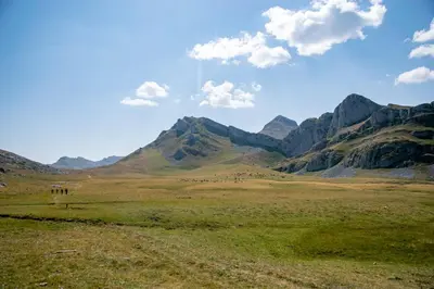 a view of a field with mountains in the background at Casa Serafo in Saliencia