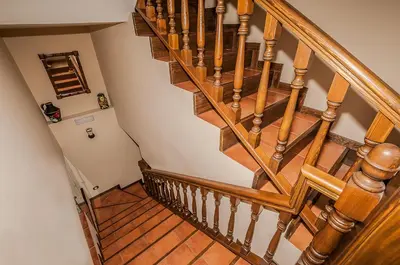 an overhead view of a wooden spiral staircase at Casa Rural El Almendro De Maria in Ponferrada