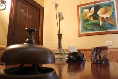 a table with two vases on top of it at Apartamentos Casa Germana in Tapia de Casariego