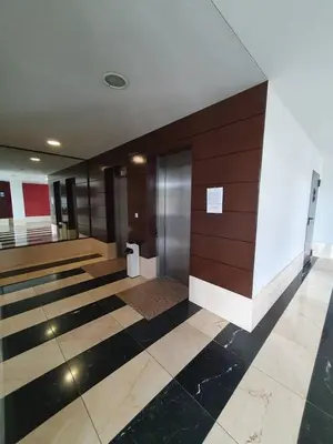 a lobby of a building with black and white tiles at Cozy Apartment Ponferrada 109 m², Parking in Ponferrada