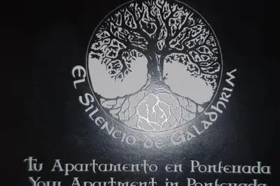 a coin with a tree on the back of it at Cozy Apartment Ponferrada 109 m², Parking in Ponferrada